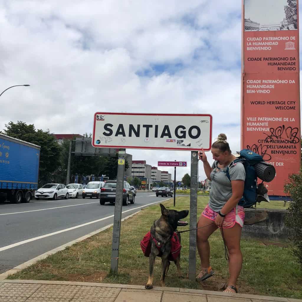 Maverick and Colby at the entrance sign in Santiago de Compostela